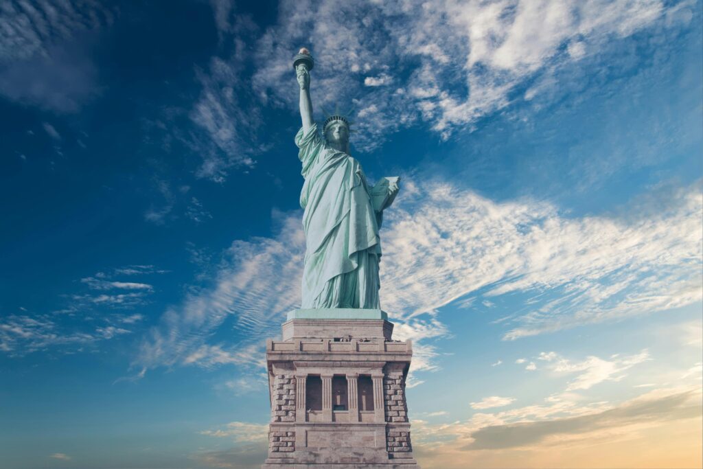 Iconic Statue of Liberty with a vibrant blue sky
