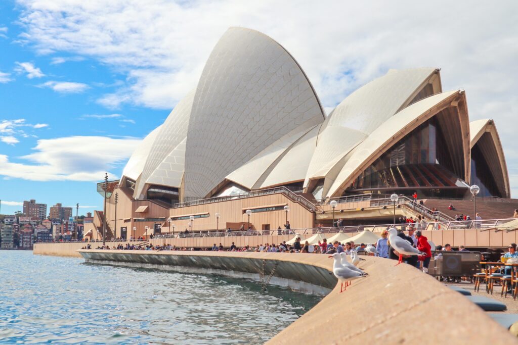 pexels-photo-2845013-2845013 Sydney Opera House with tourists and waterfront view on a sunny day.