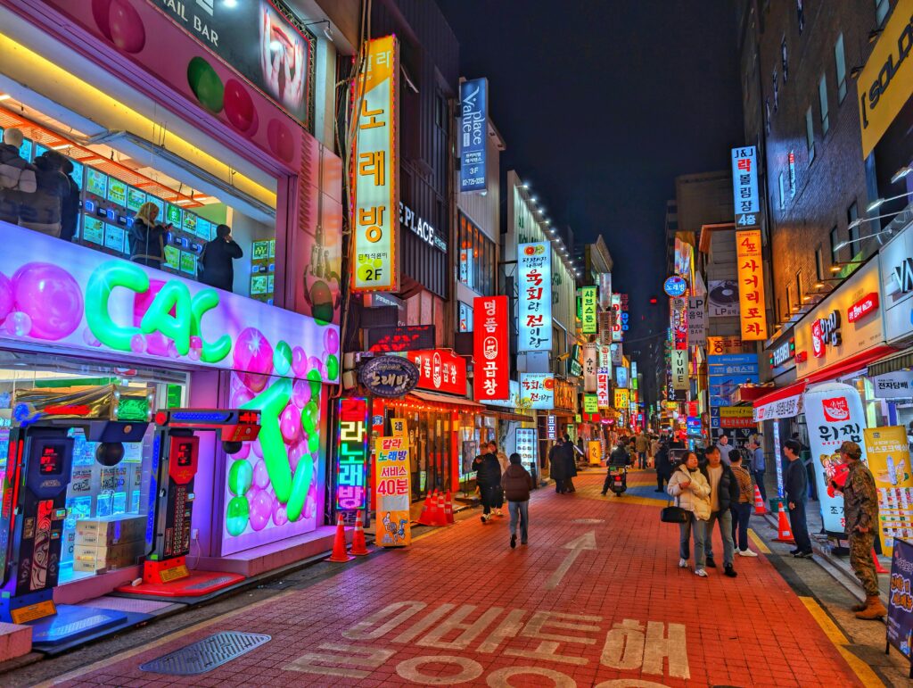 pexels-photo-35816143-35816143 Explore the vibrant nightlife of Seoul's bustling street with colorful neon signs and lively atmosphere.