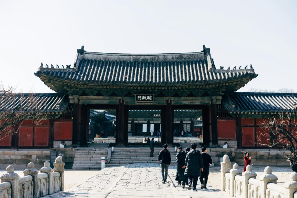 pexels-photo-4840854-4840854 Visitors exploring the ancient Gyeongbokgung Palace in Seoul's cultural heart.
